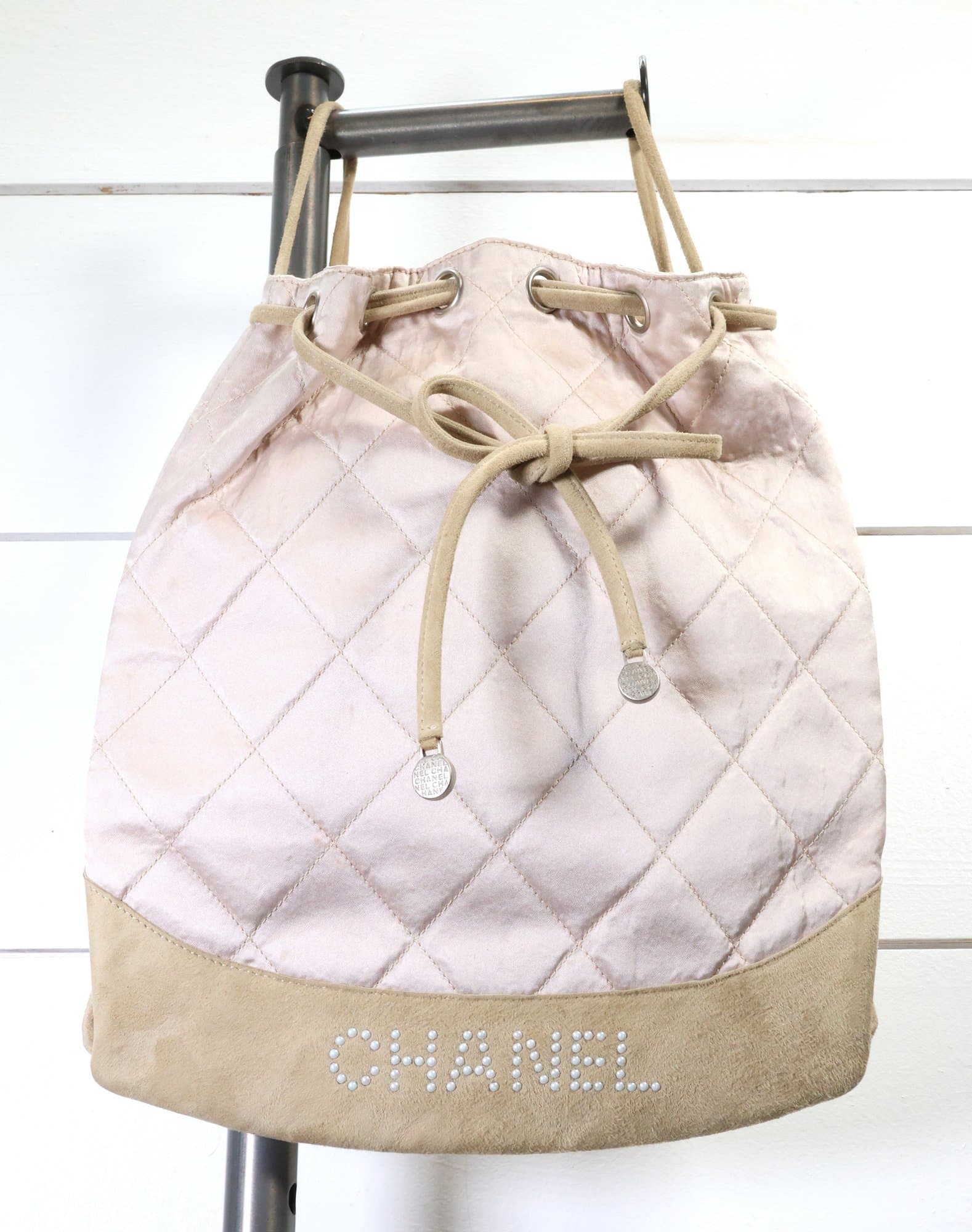 Chanel Pink Blush Quilted Silk Crystal Logo Drawstring Backpack Purse Handbag Bag handbags auction on bidia.ai