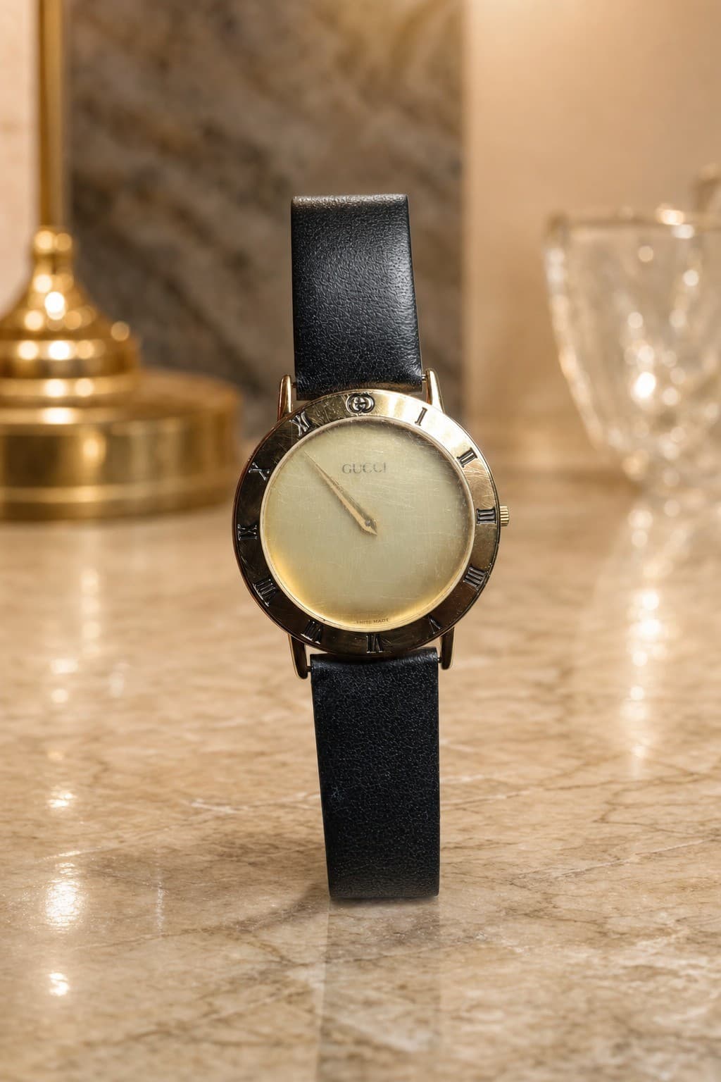 Gucci 3000.2.M Gold-Plated Roman Numeral Watch watches auction on bidia.ai
