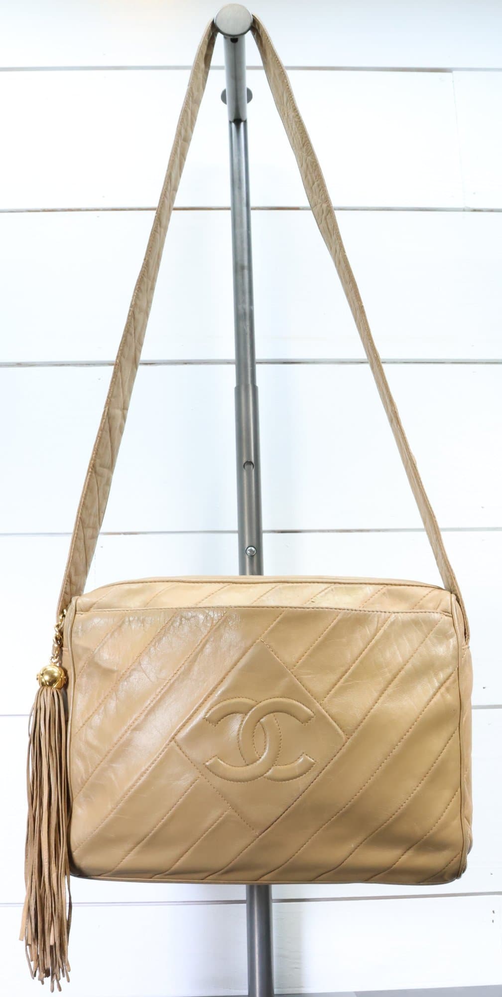 Chanel Interlocking C Beige Lambskin Diagonal Stitch CC Tassel Purse Crossbody Bag handbags auction on bidia.ai