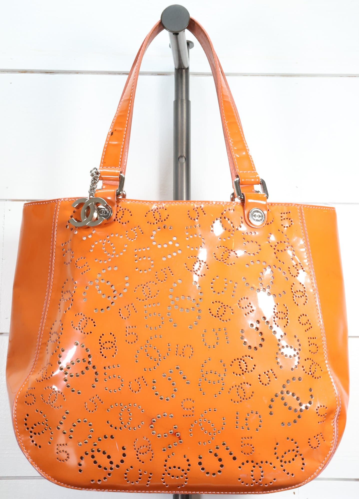 Chanel Orange Patent Leather Punching Tote Bag Perforated Logo Design Silver Hardware Charm Detail handbags auction on bidia.ai