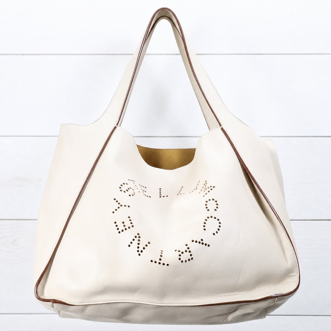 Stella McCartney Stella Logo Perforated Faux Leather Tote Bag Handbag Purse Cream handbags auction on bidia.ai
