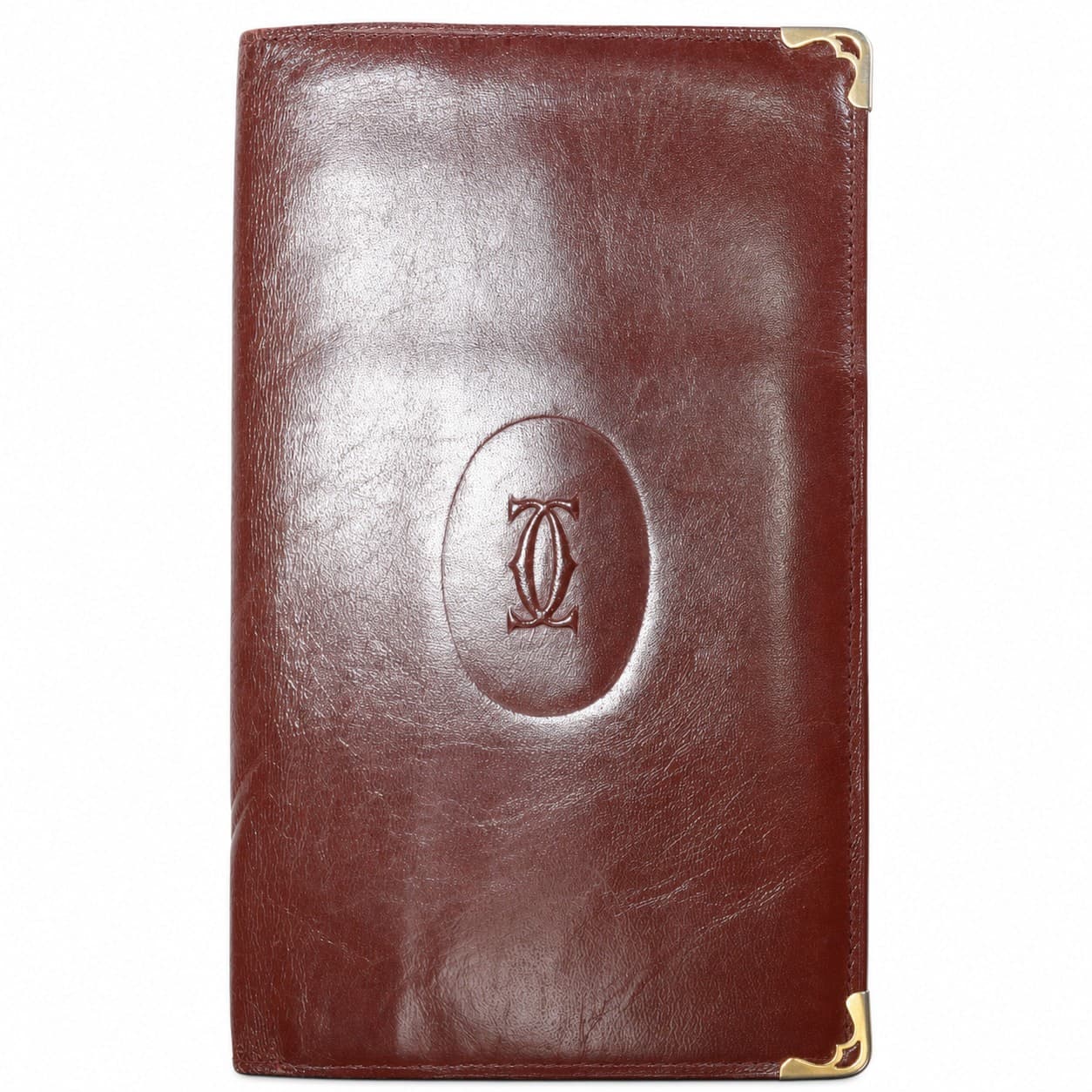 Cartier Burgundy Leather Bifold Wallet Gold Corners Must De Cartier handbags auction on bidia.ai
